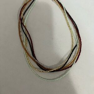 Chic Multistrand Beaded Necklace in Gold, Black, and Red